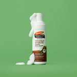 Coconut Hydrate Foaming Cleanser dispensing foam from its pump.